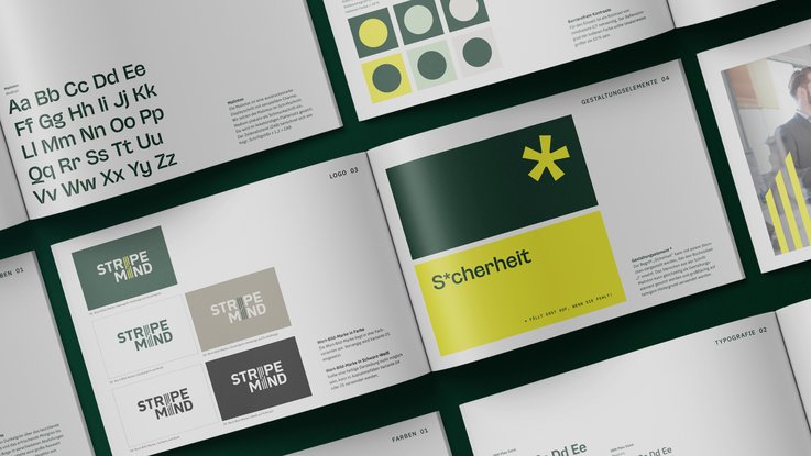 VISUELL Kommunikationsdesign: Corporate Design für STRIPEMIND VISUELL Kommunikationsdesign: Corporate Design STRIPEMIND: Gestaltungsrichtlinien aufgeschlagen; Seiten zeigen Farbdefinitionen, Schriftarten und Anwendungen des Logos STRIPEMIND im Corporate Design.