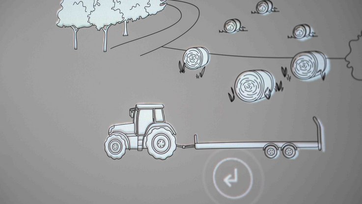 VISUELL Szenografie: Eine Illustration eines Traktors, im Hintergrund sind Heuballen und Bäume gezeichnet