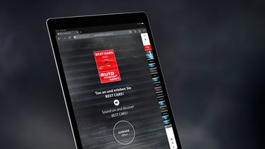 VISUELL Kommunikationsdesign: Scrollytelling-Website auf einem Ipad - Aufschrift: Ton an und erleben Sie BEST CARS, Garage öffnen